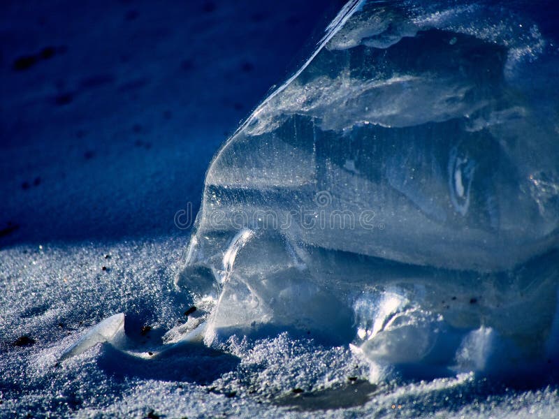Piece Of Snow On The Ice Of The Frozen Pond On Sunny Day Stock Photo