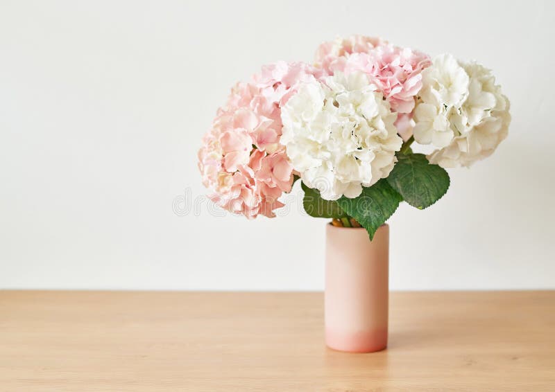 Beautiful pink hydrangea flowers in vase on table.Still life - flowers in can - rustic style, shabby chic. Card with copy space.