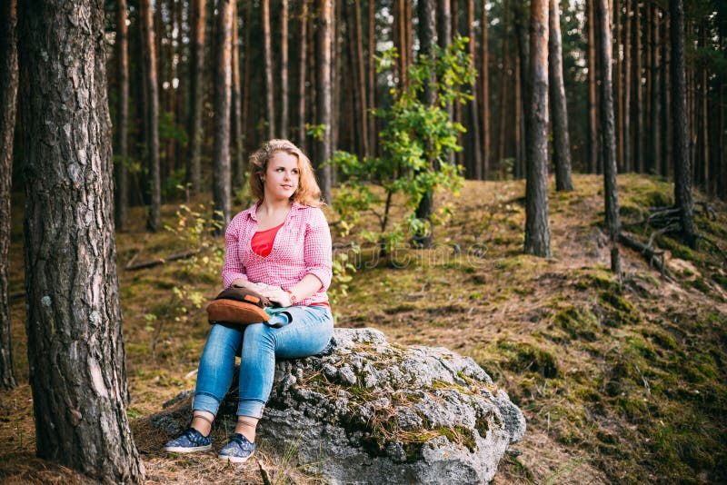 Beautiful Plus Size Young Smiling Woman Sitting on