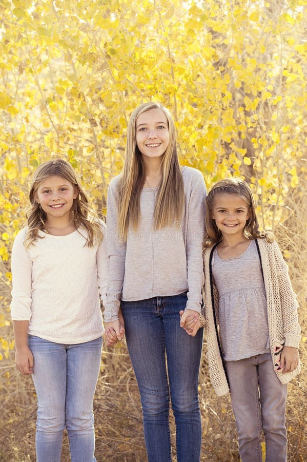 Beautiful Portrait of three little girls outdoors