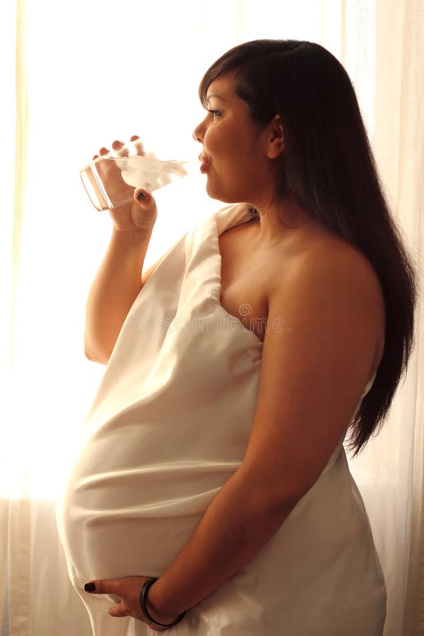 Beautiful Pregnant Latina Woman Drinking Water