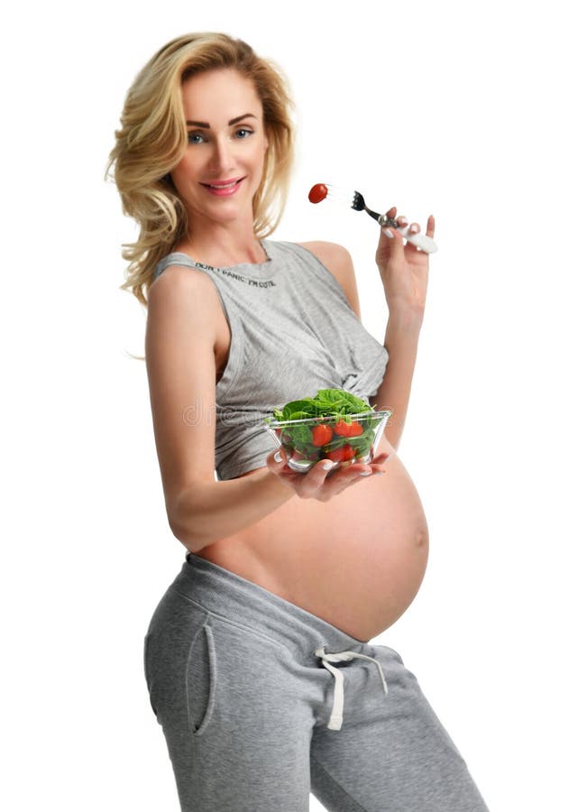 Beautiful pregnant woman hold organic salad. Pregnancy motherhood expectation healthy eating