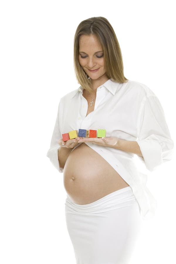 Beautiful Pregnant Woman Holding Baby Blocks