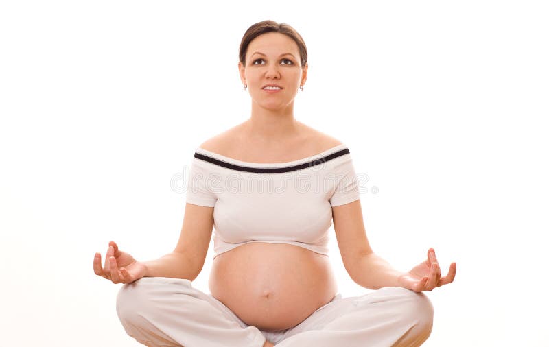 Beautiful pregnant woman meditating