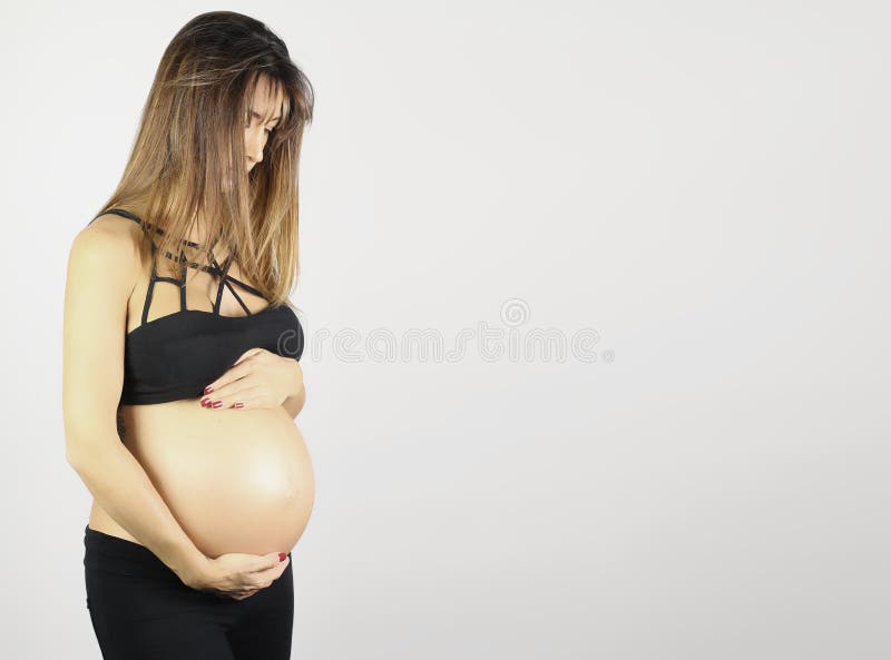 Beautiful pregnant woman showing her good shape stock photography Beautiful pregnant woman showing her good shape stock photography