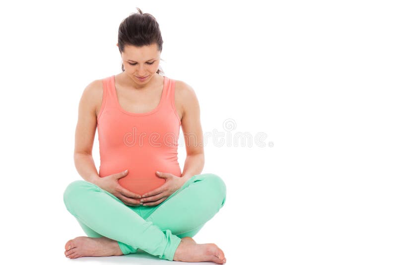 Beautiful pregnant woman sitting