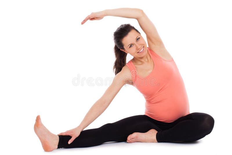 Beautiful pregnant woman working out isolated