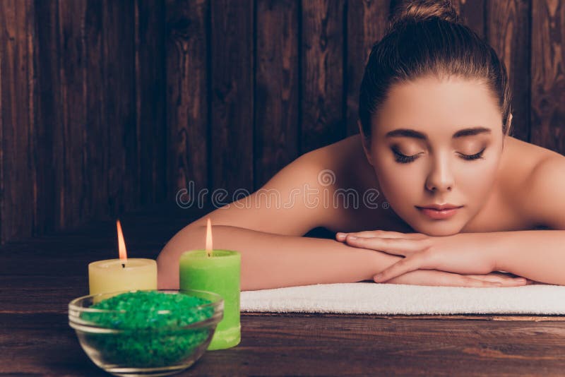 Beautiful Pretty Young Woman Laying In Spa Salon With Closed Eyes And