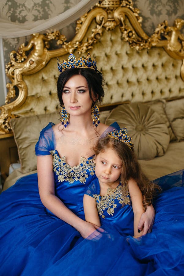 Beautiful Princess Mother and Daughter in a Gold Crown Stock Photo ...