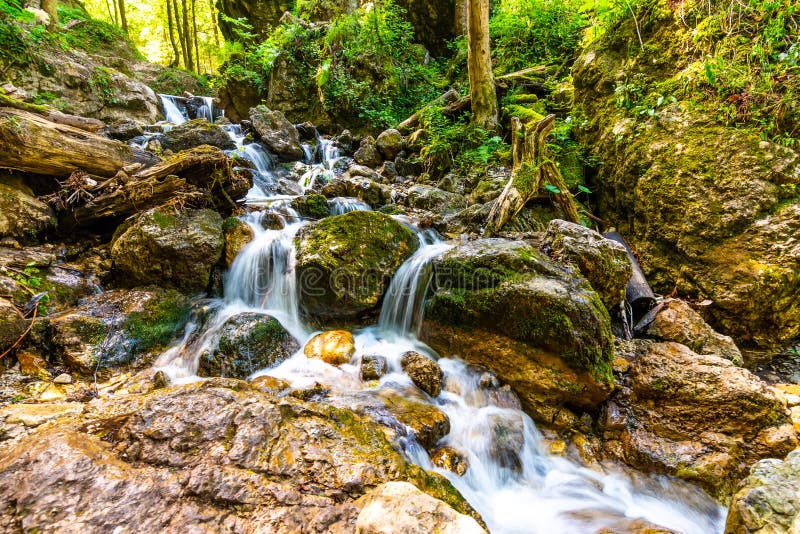 Beautiful pure waterfall in Slovakia national park Mala Fatra - Janosikove Diery, near the Terchova village. Fresh water stream on