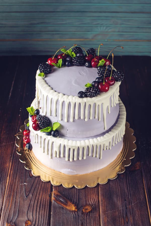 Beautiful Purple Cake with Streaks of White Cream and Decorated with ...
