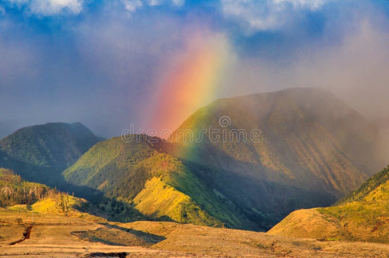 Beautiful rainbow across the west Maui mountains at sunset. Spiritual sunset rainbow across west maui in Lahaina royalty free stock photo Beautiful rainbow across the west Maui mountains at sunset. Spiritual sunset rainbow across west maui in Lahaina royalty free stock photo