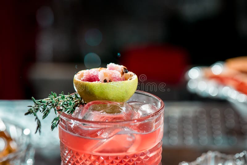 Beautiful Red Cocktail With Ice In Faceted Glass, Decorated With ...