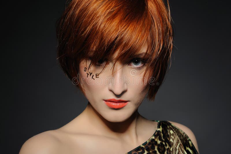 Beautiful red heaired woman with fashion hairstyle