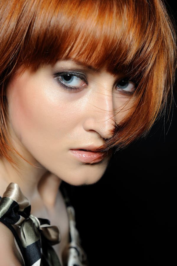 Beautiful red heaired woman with fashion hairstyle