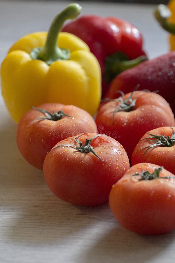 Beautiful Red Tomatoes on the Kitchen Counter with Other Vegetables