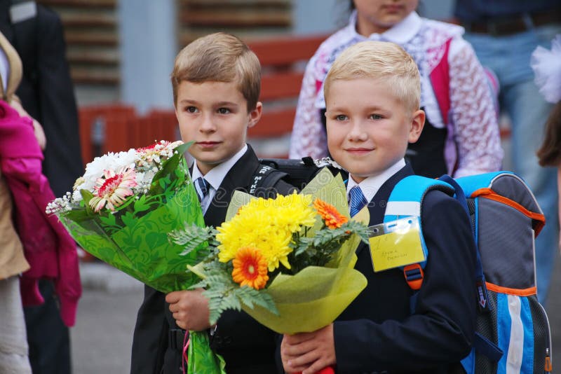 Beautiful, richly and solemnly dressed children with flowers at the school festival of knowledge royalty free stock photos Beautiful, richly and solemnly dressed children with flowers at the school festival of knowledge royalty free stock photos