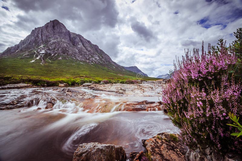 Beautiful river mountain landscape scenery in Glen Coe, Scottish Highlands, Scotland