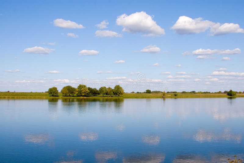 Beautiful river and yellow meadow