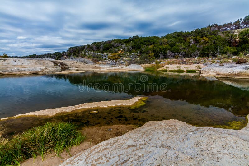 Beautiful Rock Formations Carved Smooth by the Crystal Clear Blue-Green Waters of the Pedernales River in Texas.