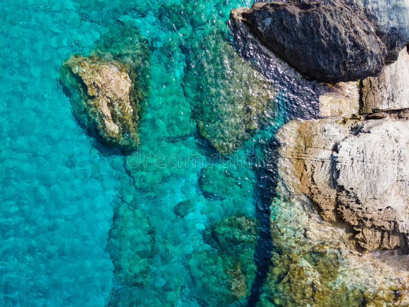 The beautiful rock formations and emerald sea of the Greek island Andros