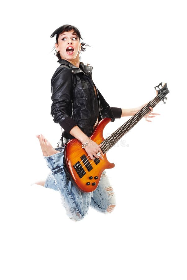 Beautiful rock-n-roll girl jumping with guitar