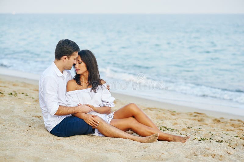 Beautiful romantic couple on the sea shore