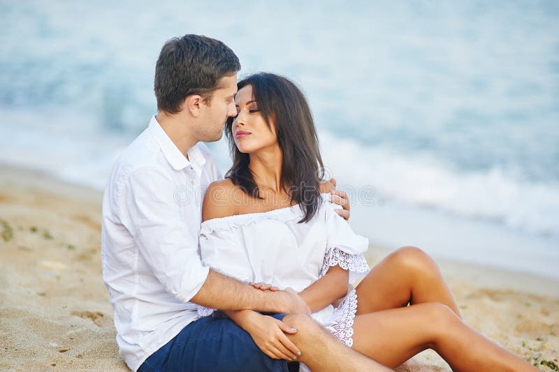 Beautiful romantic couple on the sea shore