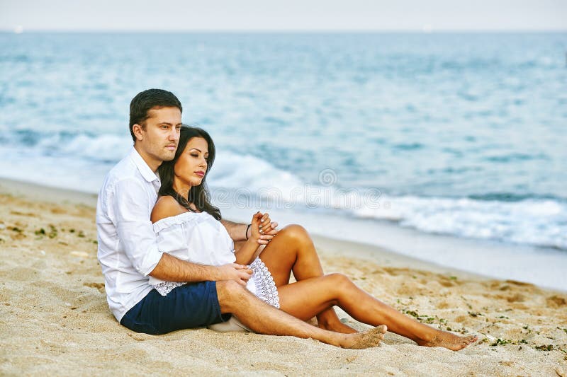 Beautiful romantic couple on the sea shore