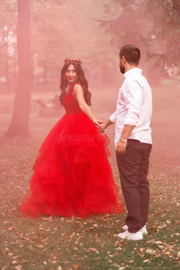 Woman in Red Wedding Dress and Man in Tuxedo and Hat · Free Stock Photo