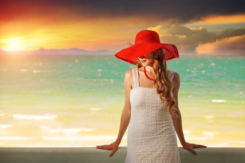 Beautiful romantic model in red hat with red lips