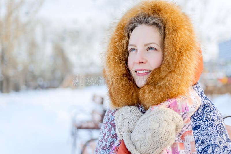 Beautiful Russian Woman in a Fur Hood and Woolen Mittens. Outdoor Fashion  Winter Portrait. Stock Image - Image of january, cold: 130981183