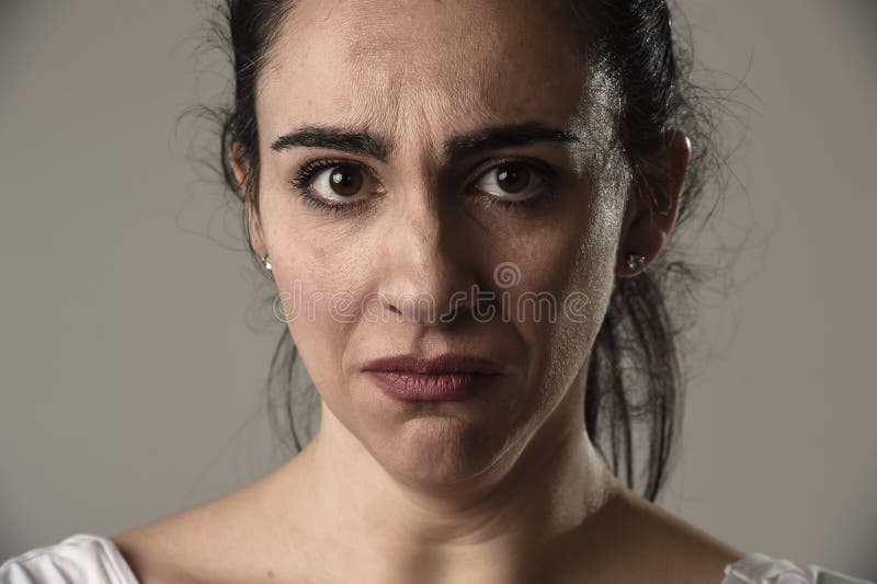 Beautiful and sad woman crying desperate and depressed with tears on her eyes suffering pain stock photography Beautiful and sad woman crying desperate and depressed with tears on her eyes suffering pain stock photography