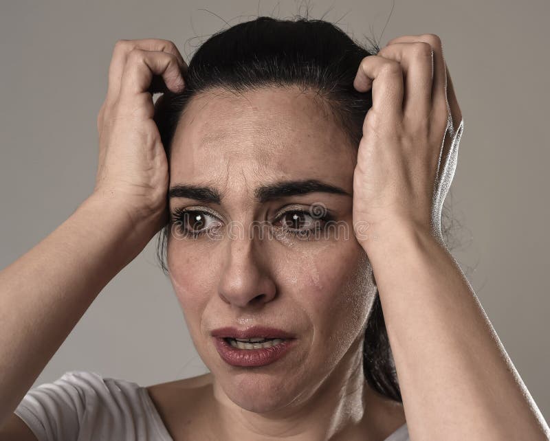 Beautiful And Sad Woman Crying Desperate And Depressed With Tears On