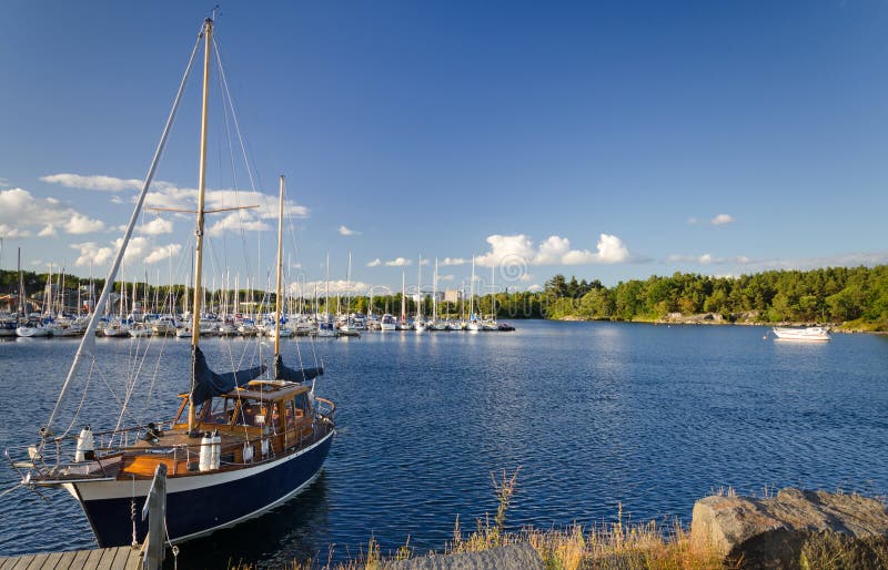 Beautiful sailboat in Swedish sea bay royalty free stock photography