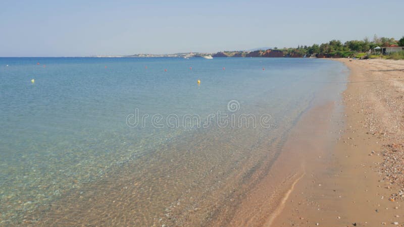 Beautiful sand beach and blue water sea. Greece.