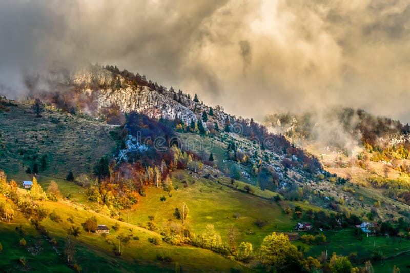 Beautiful scenery landscape Romania Magura Pestera village mountains hills fields foggy morning