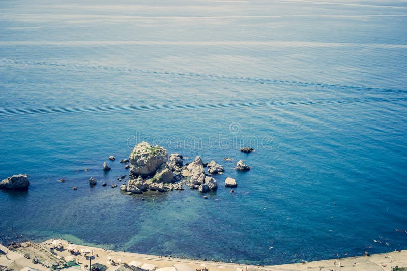 Beautiful seascape. Blue water lagoon on a bright sunny day. Beautiful seascape. Sudak Bay on Black sea Blue water lagoon on a bright sunny day and mountains stock image Beautiful seascape. Blue water lagoon on a bright sunny day. Beautiful seascape. Sudak Bay on Black sea Blue water lagoon on a bright sunny day and mountains stock image
