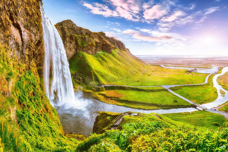 Beautiful  Seljalandsfoss waterfall in Iceland during the sunset