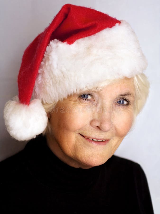 Beautiful senior woman with Santa hat