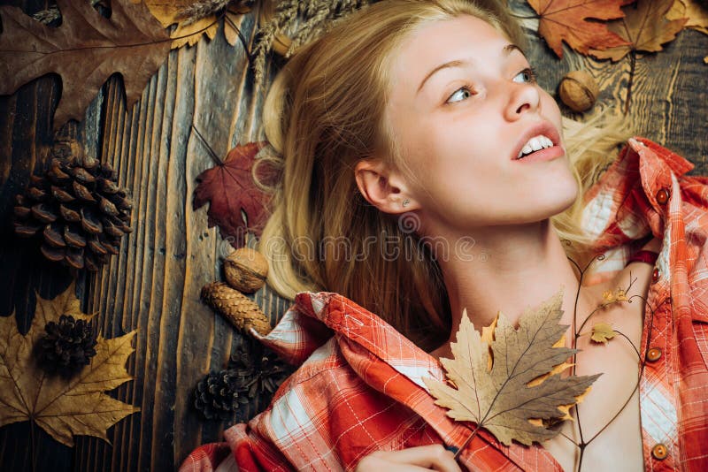 Beautiful sensual blonde playing with leaves. Background with autumn leaves. Happy young woman preparing for autumn stock photos Beautiful sensual blonde playing with leaves. Background with autumn leaves. Happy young woman preparing for autumn stock photos