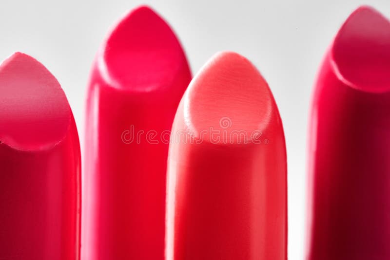Beautiful set of lipsticks in red colors. Beauty cosmetic collection. Macro close up shot. Fashion trends in cosmetics with bright lips, delisious textures. Beautiful set of lipsticks in red colors. Beauty cosmetic collection. Macro close up shot. Fashion trends in cosmetics with bright lips, delisious textures
