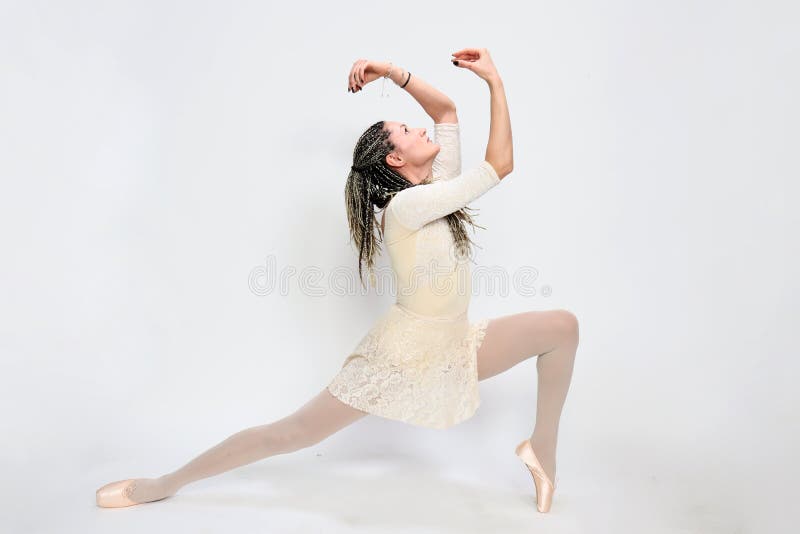 Beautiful, sexy blonde ballerina girl with afro braids posing in studio on isolated background.  Ballet, art, fashion concept.