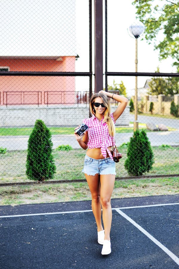 Beautiful Girl In Shorts And Sunglasses Posing With Old