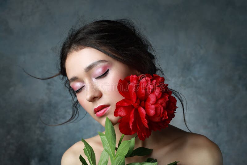 Beautiful sexy stylish young adult in elegant dress with nice bouquet of pink peonies. Studio retouched shot royalty free stock photos Beautiful sexy stylish young adult in elegant dress with nice bouquet of pink peonies. Studio retouched shot royalty free stock photos
