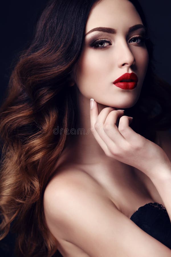 Beautiful woman with dark hair and bright makeup stock photo Beautiful woman with dark hair and bright makeup stock photo