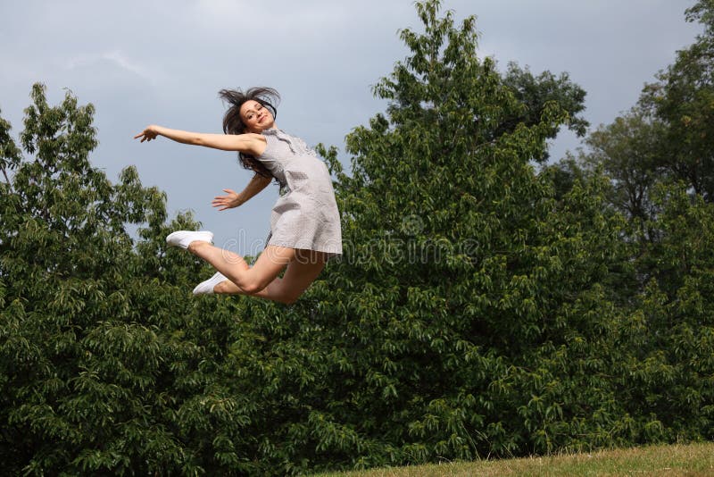 Beautiful woman flying jump for fun success royalty free stock photos Beautiful woman flying jump for fun success royalty free stock photos