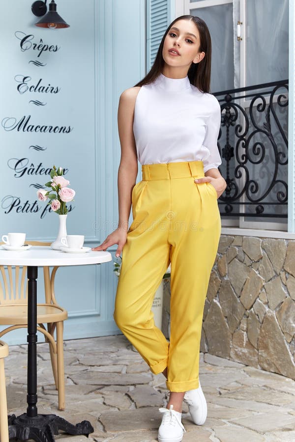 beautiful sexy woman wear fashion summer collection clothes casual style blouse yellow trousers slim body pretty face model 147150435