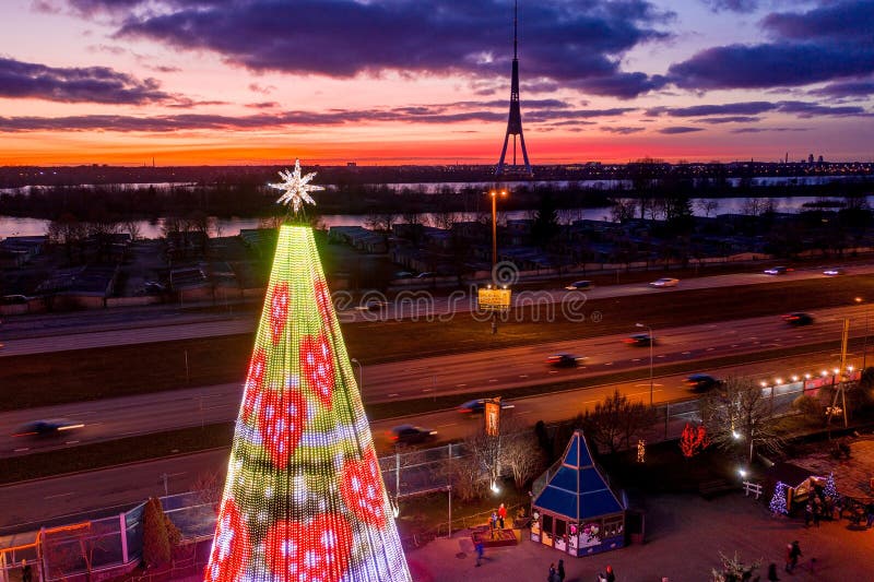 Beautiful Shot of a Christmas Tree in an Amusement Park at Sunset Stock