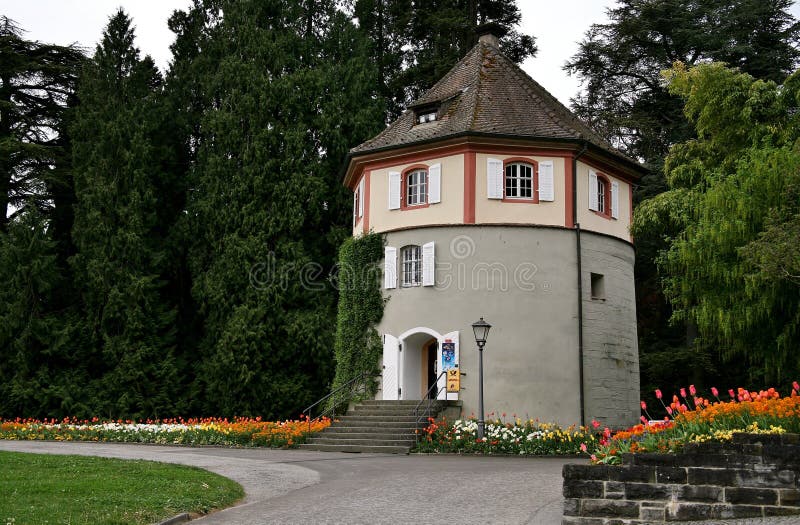 Beautiful shot of a Gardener's tower with the background of nature on the island of Mainau stock image Beautiful shot of a Gardener's tower with the background of nature on the island of Mainau stock image